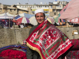Man Selling Rugs on Banks of Kabul River, Central Kabul, Afghanistan Photographic Print by Jane Sweeney