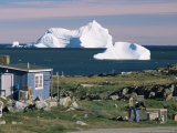 Painted Wooden Fisherman's House in Front of Icebergs in Disko Bay, Disko Island, Greenland Photographic Print by Tony Waltham