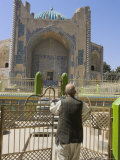 Man Opening Doors to Collection of Graves in Front of Shrine of Khwaja Abu Nasr Parsa, Afghanistan Photographic Print by Jane Sweeney