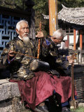 The Naxi Orchestra Pracisting by the Black Dragon Pool, Lijiang, Yunnan Province, China Lámina fotográfica por Doug Traverso