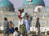 Family Feeding the Famous White Pigeons, Shrine of Hazrat Ali, Mazar-I-Sharif, Afghanistan Photographic Print by Jane Sweeney