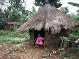 Little Girl Dressed for Church, in Front of Hut, Uganda, East Africa, Africa Photographic Print by D H Webster