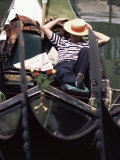 Gondolier Relaxing in Gondola, Venice, Veneto, Italy Photographic Print by Adam Woolfitt
