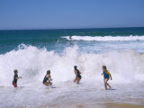 Children Playing in the Surf, Near Gosford, New South Wales, Australia Photographic Print by Ken Wilson