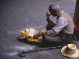 Tibetan Buddhist Pilgrim Reading Texts and Holding Prayer Wheel, Lhasa, China Photographic Print by Alison Wright