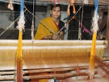 A Woman Weaving at One of the Cooperatives in an Area That is Famous for Its Saris Photographic Print by R H Productions 