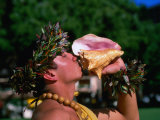 Man Blowing Conch Shell, Oahu, Hawaii Photographic Print by Lee Foster