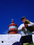 Lone Bagpiper Plays Beneath the Cabo Da Roca Lighthouse, Sintra, Estremadura, Portugal Photographic Print by Anders Blomqvist
