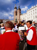 Folk Musicians on Rynek Glowny with St. Mary's Church in Background, Krakow, Malopolskie, Poland Photographic Print by Witold Skrypczak