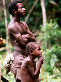 Man and Boy Watching Work, Oriomo Plateau, Western, Papua New Guinea Photographic Print by Oliver Strewe