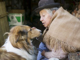 Elderly Female Vendor at Mercado de Los Brujas with Her Dog, La Paz, Bolivia Photographic Print by Brent Winebrenner