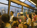 Passengers on the Peak Tram Ascending Victoria Peak, Hong Kong, China Photographic Print by Greg Elms
