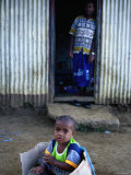Young Boy Playing in Box Outside Home, Viti Levu, Western Division, Fiji Photographic Print by Daniel Boag