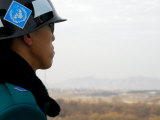 South Korean Rok Soldier in Joint Security Area Looking to the North Across Dmz, Seoul, South Korea Photographic Print by Anthony Plummer