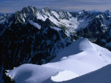Skiers and Climbers Head Out over Aiguille du Midi with Matterhorn Point Peak, Chamonix, France Fotografie-Druck von Glenn Van Der Knijff