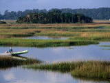 Man in Outboard Canoe on Moon River, Tybee Island, Georgia Photographic Print by John Elk III
