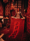 Carpet Trader Displaying a Woolen Carpet, Peshawar, North-West Frontier Province, Pakistan Photographic Print by Richard I'Anson