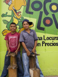 Shoeshine Boys Posing in Front of Colourful Wall, Esteli, Nicaragua Photographie par Margie Politzer
