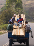 Men Riding on Back of Truck Carrying Timber, Near Esteli, Nicaragua Photographic Print by Margie Politzer