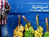 Watch Seller and Bunches of Bananas Outside Vegetable Market, Male, Kaafu, Maldives Photographic Print by Felix Hug