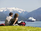 Couple Looking over Sitka Sound with Universe Explorer in Background, Sitka, Alaska Photographie par Brent Winebrenner