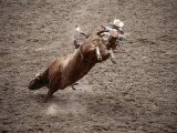Man Bullriding at Cheyenne Frontier Days Rodeo, Cheyenne, Wyoming Photographic Print by Holger Leue