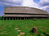 Longhouse in Stave Style at Viking Ring Fortress, Trelleborg, West Zealand, Denmark Photographic Print by John Elk III