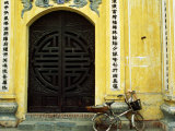 Yellow Nguyen Thai Hoc Temple Entrance and Bicycle, Hanoi, Vietnam Photographic Print by Anthony Plummer