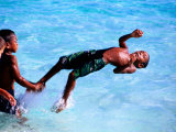 Children Playing in Water, Lifou Island, Loyalty Islands, New Caledonia Photographie par Peter Hendrie