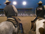 Cowboys on Horseback at Cody Night Rodeo, Cody, Wyoming Photographic Print by Lee Foster