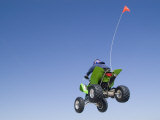 Airborne Atv Rider, Pismo Beach, California Impressão fotográfica por Brent Winebrenner