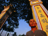 76 Year Old Man Visits One of Hue's Ornate Communal Houses, Vietnam Photographic Print by Stu Smucker