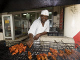 Man Grilling Skewers in Restaurant, Dar Es Salaam, Tanzania Photographic Print by Ariadne Van Zandbergen