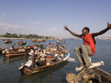 Young Man Clowning Around on Fishing Boat at Kibongoni, Dar Es Salaam, Tanzania Photographie par Ariadne Van Zandbergen