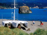 Grounded Yacht and People on Beach, Port Orford, Oregon Photographic Print by Richard Cummins