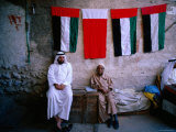 Vendors Sitting in a Bazaar, Dubai, United Arab Emirates Photographic Print by Michael Coyne