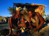 Kalahri Bushmen Cooking on Fire Outside Their Grass Homestead, South Africa Photographic Print by Ariadne Van Zandbergen