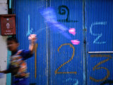 Boy Glides Kite in Street, Ko Panyi, Phang-Nga, Thailand Fotografisk trykk av Dominic Bonuccelli Boy Glides Kite in Street, Ko Panyi, Phang-Nga, Thailand Fotografisk trykk av Dominic Bonuccelli