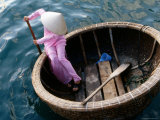 Woman Rows Basket Boat on Vietnam's South Central Coast, Nha Trang, Khanh Hoa, Vietnam Photographic Print by Stu Smucker