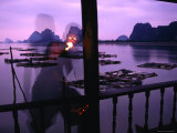 Local Man Lights Pipe Overlooking Net Farms and Karst Formations, Ko Panyi, Phang-Nga, Thailand Fotografisk trykk av Dominic Bonuccelli Local Man Lights Pipe Overlooking Net Farms and Karst Formations, Ko Panyi, Phang-Nga, Thailand Fotografisk trykk av Dominic Bonuccelli