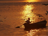 Boat on the River Ganges in Allahabad, India Photographic Print by Rajesh Kumar Singh