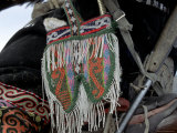 Pouch Holds Food for Eagles, Golden Eagle Festival, Mongolia Photographie par Amos Nachoum