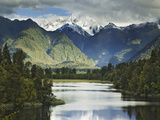 Cloud-Shrouded Mt. Cook Reflected in Lake Matheson, Near Town of Fox Glacier, South Island Photographic Print by Dennis Flaherty