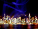 Skyline at Night Reflected in Victoria Harbour, Kowloon, Hong Kong Photographic Print by Russell Gordon