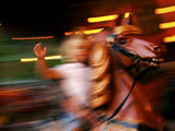 Child on Carousel at Grona Lund Amusement Park, Stockholm, Sweden Photographic Print by Nancy & Steve Ross