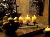 Still Life with Lighted Candles and Bowl of Lemons in Coffee Shop, Tallinn, Estonia 写真プリント - Nancy & Steve・Ross