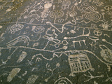 Circular Petroglyphs at the Edge of the Great Basin, Sierra Nevada Range in the Distance, Las Vegas Photographie par Dennis Flaherty