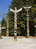 Totems in Stanley Park, Vancouver, British Columbia, Canada Photographic Print by Robert Harding