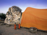 Two Novice Buddhist Monks in Front of a Statue of the Reclining Buddha, Central Thailand, Thailand Photographic Print by Gavin Hellier
