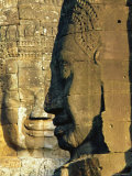 Stone Heads Typifying Cambodia on the Bayon Temple at Angkor Wat, Siem Reap, Cambodia, Asia. Photographic Print by Bruno Morandi